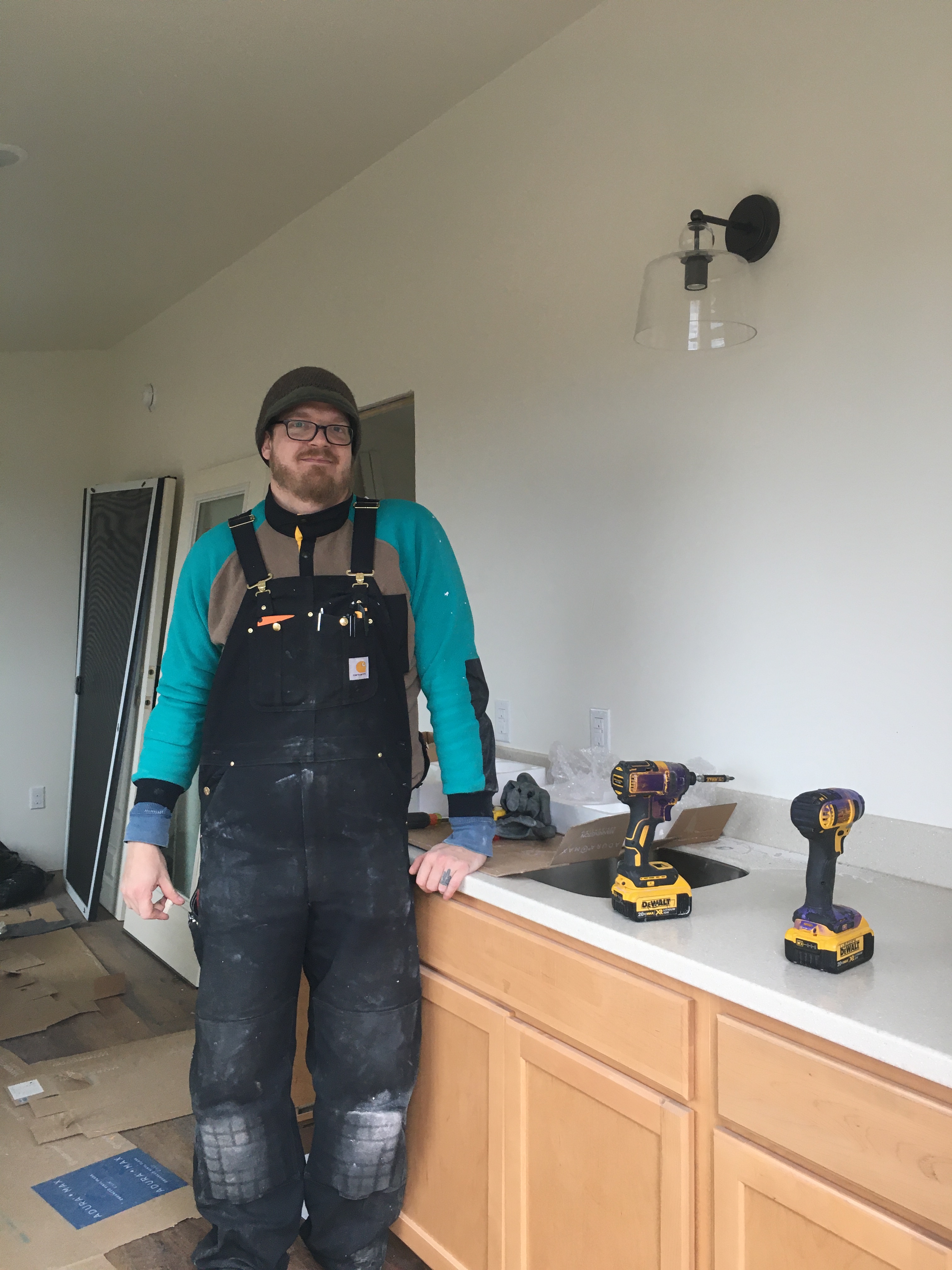 Electrician standing by wall